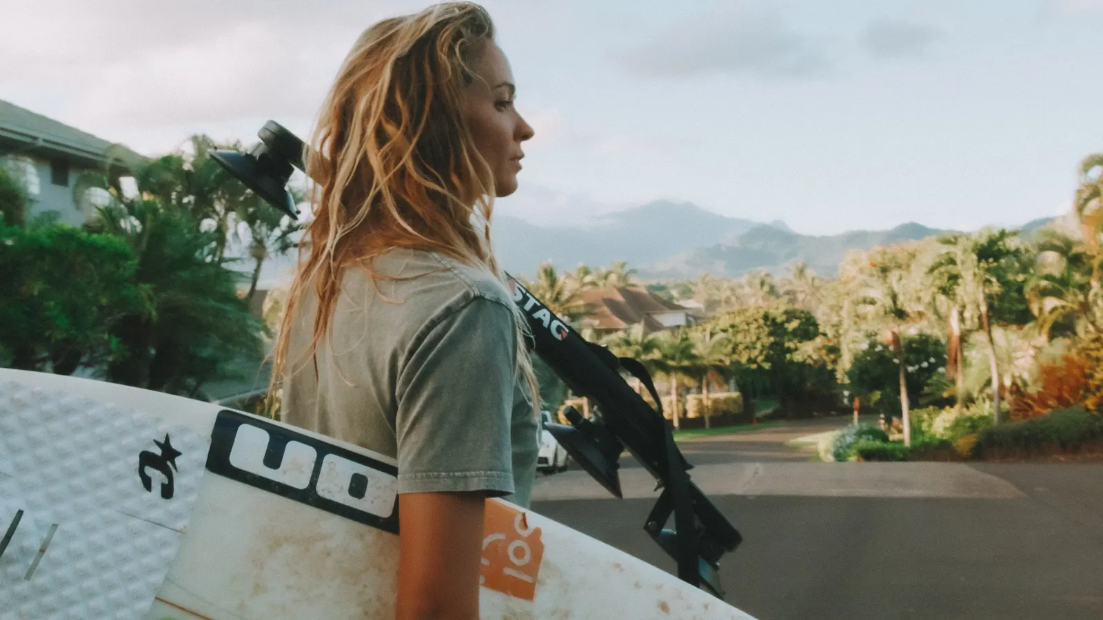 Surfer carrying a board